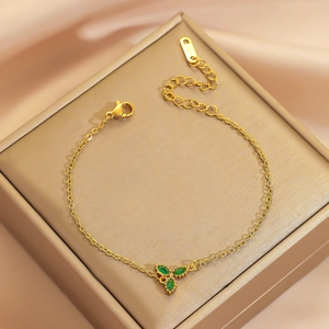 Golden titanium steel flower bracelet with emerald green marquise stones and S925 tag