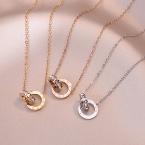Double ring pendant necklaces in gold, rose gold and silver with Roman numerals and crystals