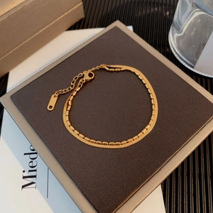 Dual-layer titanium steel snake and bead bracelet in gold finish with adjustable clasp