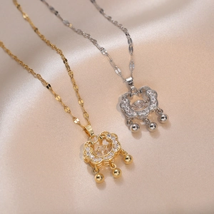 Retro longevity lock necklace with heart zircon and bells on elegant satin background