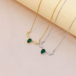 Titanium steel reindeer antler necklace with green pear-cut zircon in gold and silver