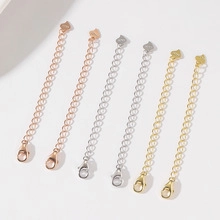 Detail view of extender chains with lobster clasps in rose gold, silver, and gold finish