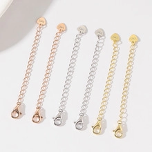 Detailed macro view of S925 sterling silver heart tags and lobster clasps in three colors