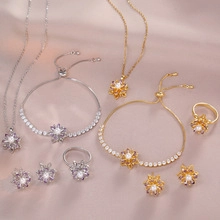Detail of snowflake flower jewelry set with sparkling zircon stones in gold and silver