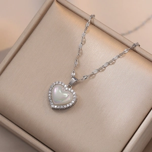 Elegant heart pendant necklace with shimmering mermaid shell and pavé cubic zirconia diamonds