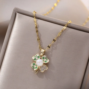 Gold plated titanium clover necklace featuring pearl inlay and sparkling zircon crystals