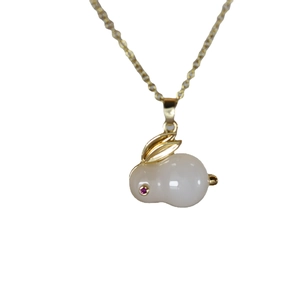 Titanium rabbit pendant necklace with white stone and zircon eye on white background