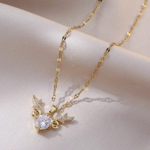 Elegant gold titanium reindeer horn necklace featuring a large sparkling zircon stone