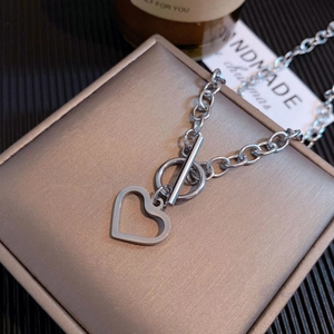 Minimalist titanium steel necklace featuring a hollow heart pendant and T-bar toggle clasp