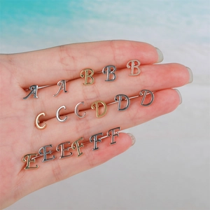Minimalist 18K gold letter earrings with screw ball backs in gold and silver finish