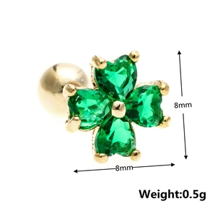 Detailed macro view of 8mm four-leaf clover stud earring with green heart-shaped zircons