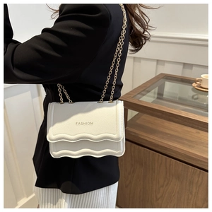 White litchi pattern chain shoulder bag with wavy edges and gold fashion lettering