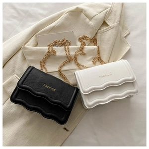 Minimalist litchi leather chain shoulder bag with wavy edge design and gold hardware