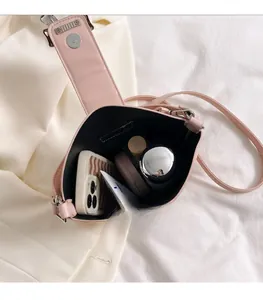 Pink bucket bag interior view showing large capacity for phone and cosmetics