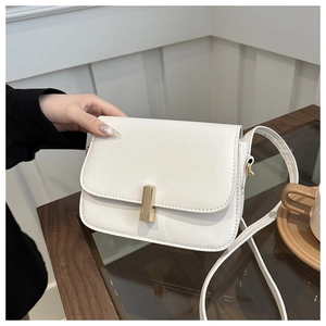 White leather crossbody bag with gold buckle and thin shoulder strap for women