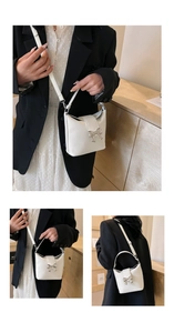 Detailed views of a white leather bucket bag with a silver metal bow accent