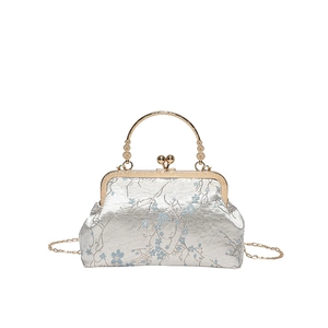 Elegant Chinese style jacquard shell bag with blue floral patterns and metal handle