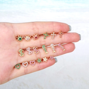 Miniature gold star and cross stud earrings with colorful cubic zirconia crystals