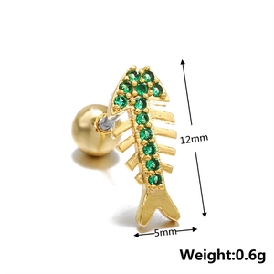 Detailed view of fishbone stud earring with green zircons in gold-plated finish