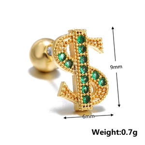 Detailed macro view of 9mm gold dollar sign stud earring with green zircon stones