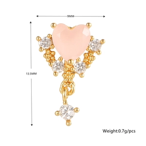 Detail of 18K gold screw back earring with pink heart crystal and white cubic zirconia