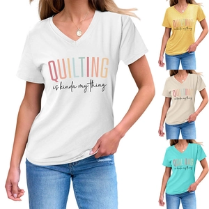 Detail of V-neck cotton T-shirt showing four color options with quilting slogan