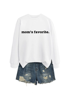 Flat lay of a white cotton sweatshirt with mom's favorite print and distressed denim shorts
