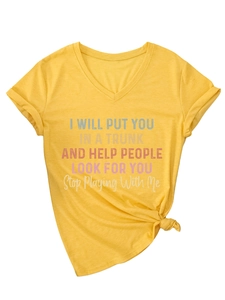 Detail of yellow V-neck T-shirt with funny quote print and trendy knotted hem design