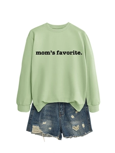 Detail of mom's favorite lettering on light green sweatshirt with distressed denim shorts