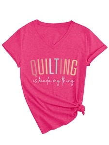 Detail of V-neck rose pink t-shirt with QUILTING IS KINDA MY THING print and knot hem
