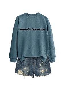 Close-up of mom's favorite printed sweatshirt paired with distressed denim shorts