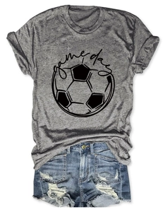 Detail of grey game day football t-shirt paired with distressed denim shorts