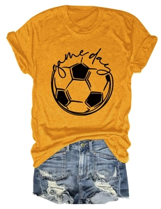 Detailed flat lay of a casual ginger Game Day football t-shirt with ripped denim shorts