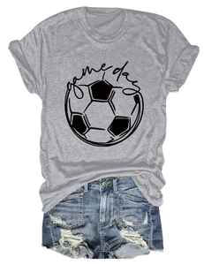 Flat lay of gray Game Day football t-shirt paired with distressed denim shorts