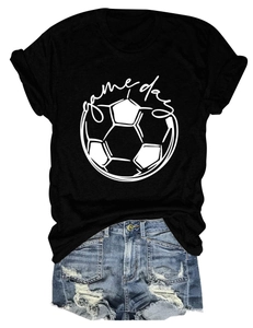Close-up of Game Day football print on a casual black t-shirt paired with denim shorts