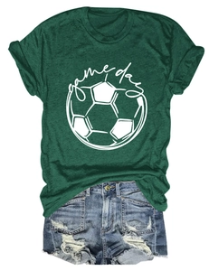 Deep green Game Day soccer t-shirt paired with denim shorts on a plain white background