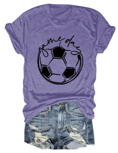 Detailed flat lay of a purple game day soccer t-shirt paired with denim shorts