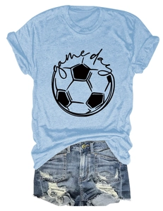 Flat lay of light blue Game Day soccer T-shirt paired with ripped denim shorts