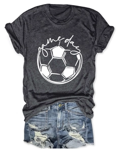 Flat lay detail of dark gray Game Day football tee paired with ripped denim shorts