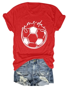 Flat lay of red Game Day soccer t-shirt and distressed denim shorts casual outfit