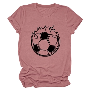 Close-up of Dusty Rose t-shirt fabric featuring black Game Day lettering and soccer ball design