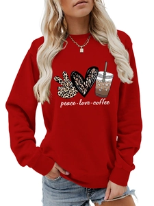 Close-up of red sweatshirt with peace love coffee graphic print and soft texture