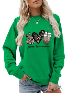 Detail of green crewneck sweatshirt featuring peace love coffee leopard print graphic