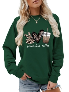 Detail of peace love coffee graphic print on dark green crewneck sweatshirt for women