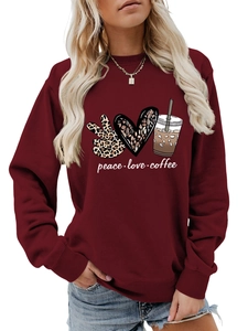 Detail of peace love coffee print on burgundy crewneck sweatshirt with leopard heart