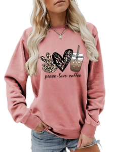 Detail of dusty rose crewneck sweatshirt featuring peace love coffee leopard graphic