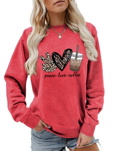 Close-up of red sweatshirt with peace love coffee graphic print and soft cotton texture