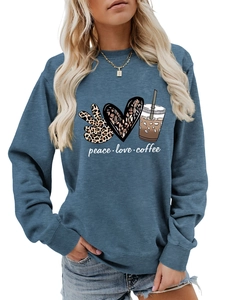 Detail of peace love coffee graphic print on navy blue long sleeve crewneck sweatshirt