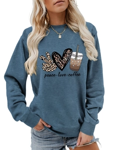 Detail of peace love coffee graphic print on dusty blue long sleeve sweatshirt