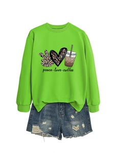 Detail of neon green peace love coffee sweatshirt with leopard print heart graphics